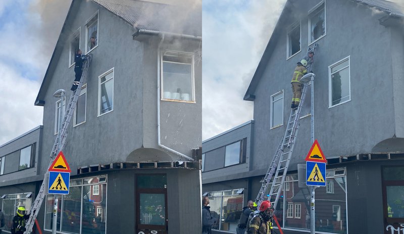 Tibor var innlyksa í eldhafinu í þrettán mínútur. Á myndinni sést hvar sjúkraflutningamaður og slökkviliðsmaður bjarga honum út. Mynd: Aðsend